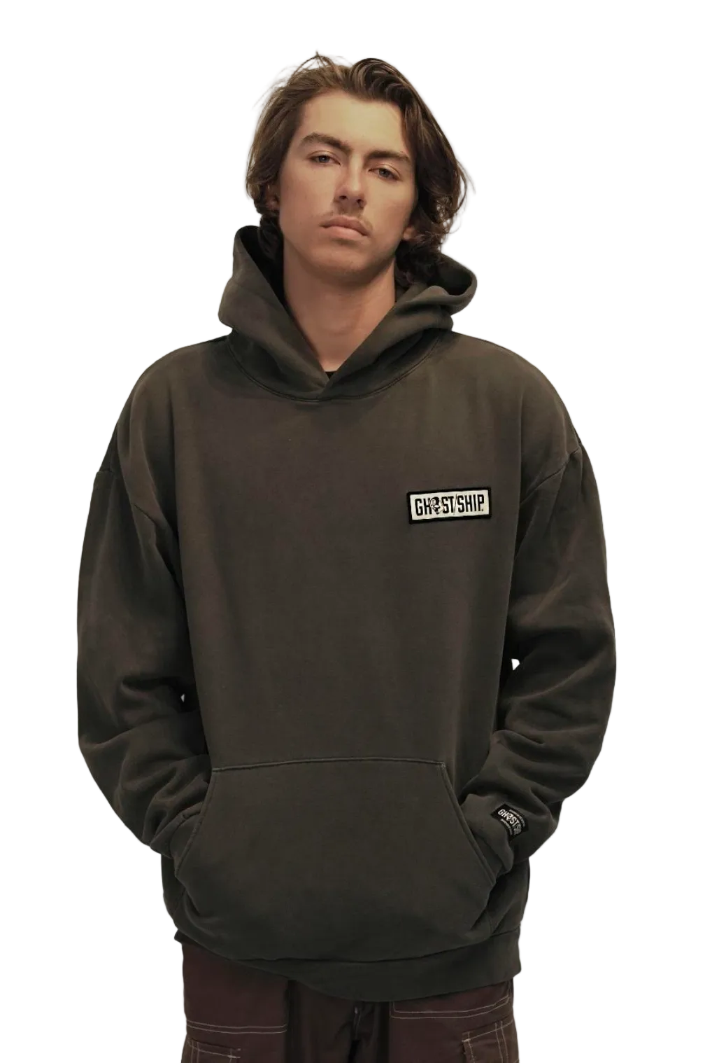Person wearing a washed black hoodie with a logo on a white background