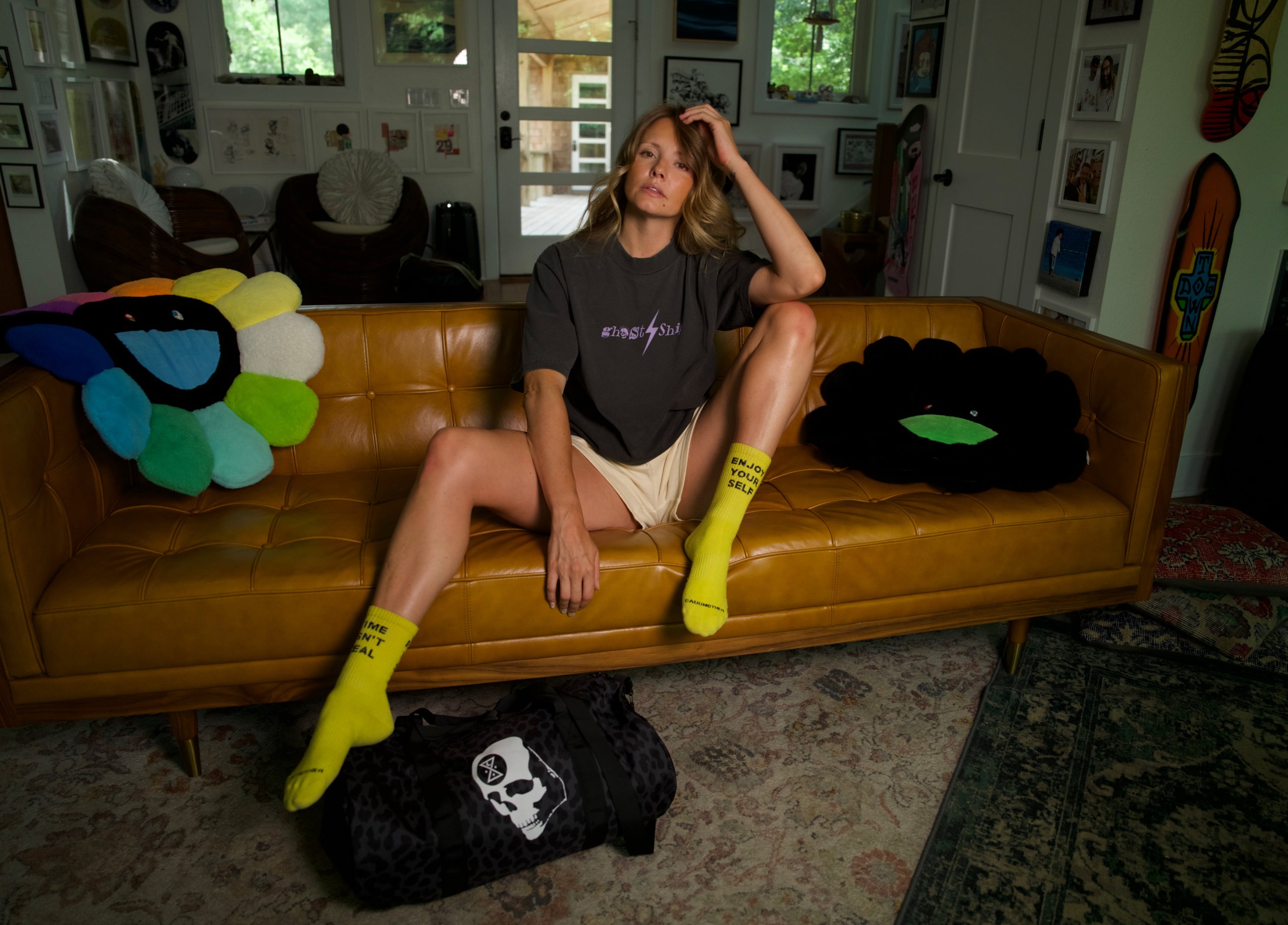 woman on leather couch in ghost ship ransom lightning bolt t-shirt